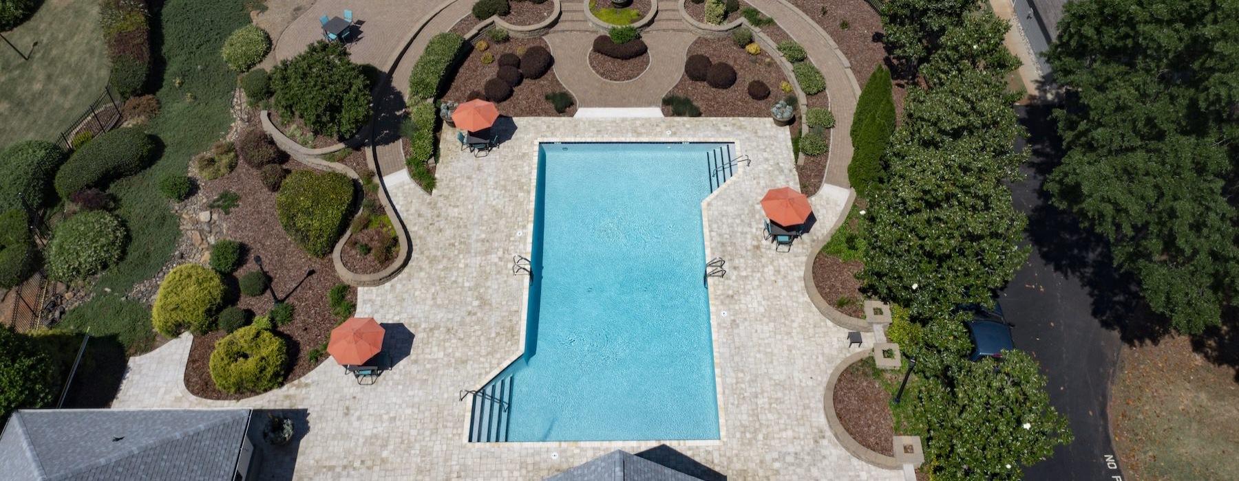 a pool surrounded by trees