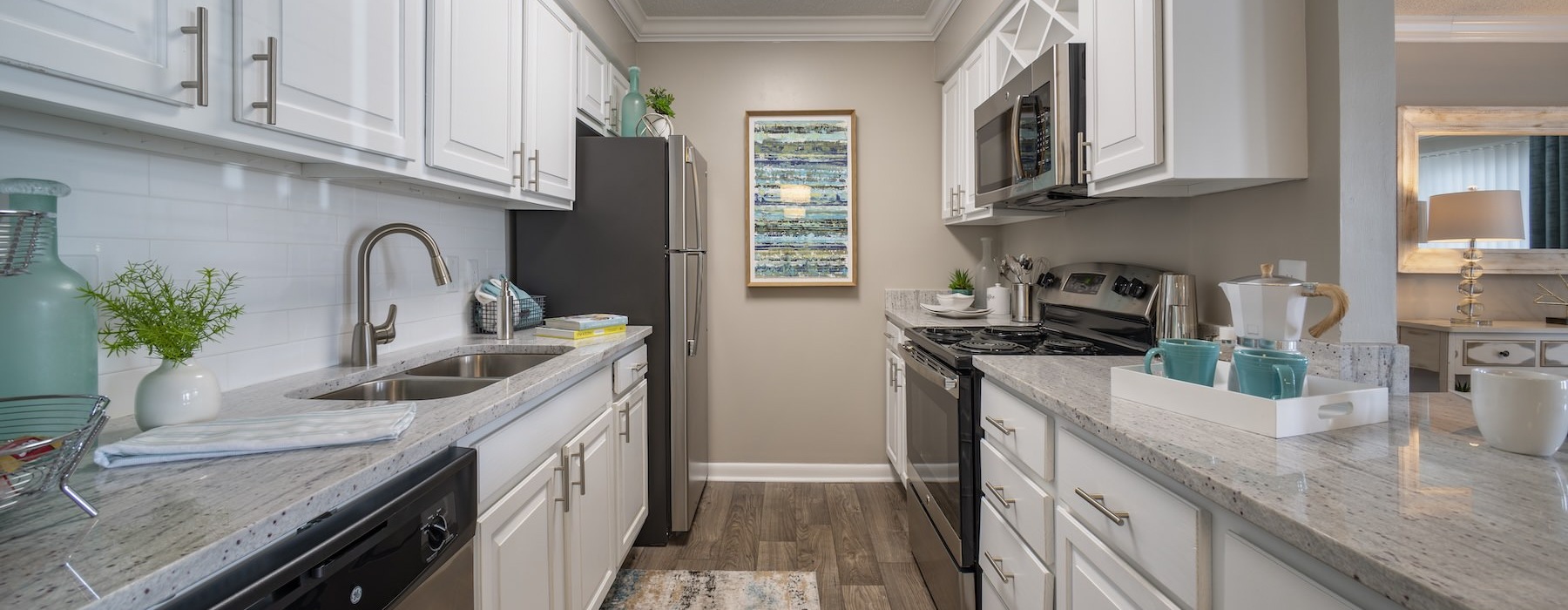 a kitchen with white cabinets