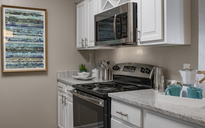 a kitchen with white cabinets